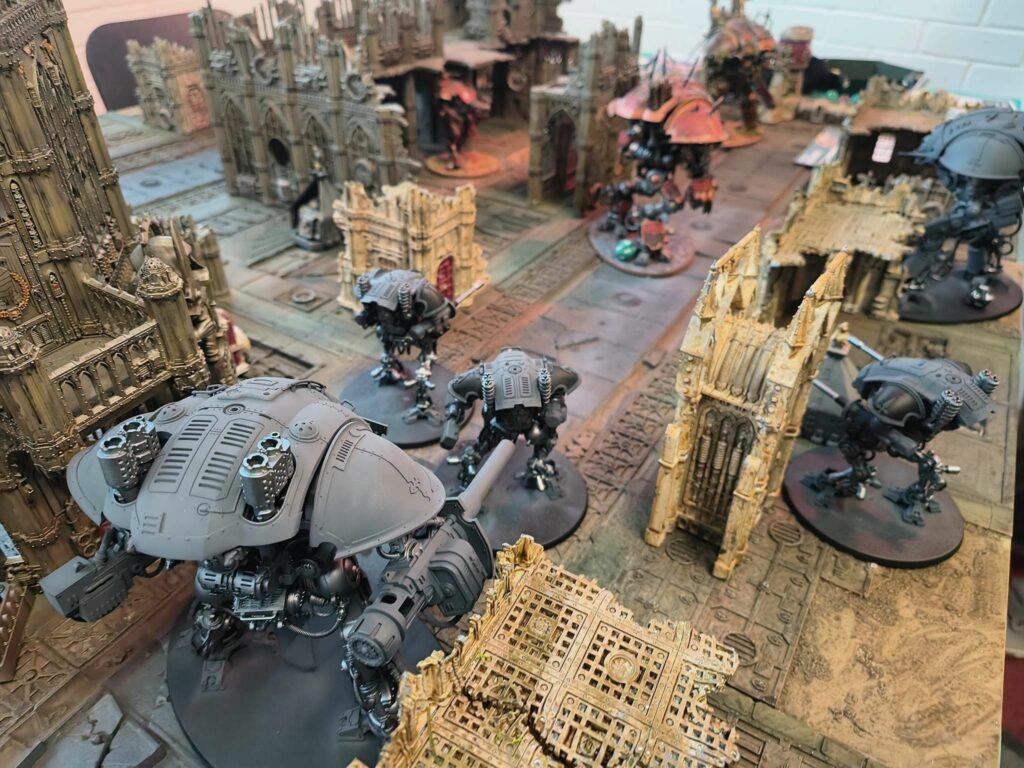 Pieces and terrain on a tabletop war game set